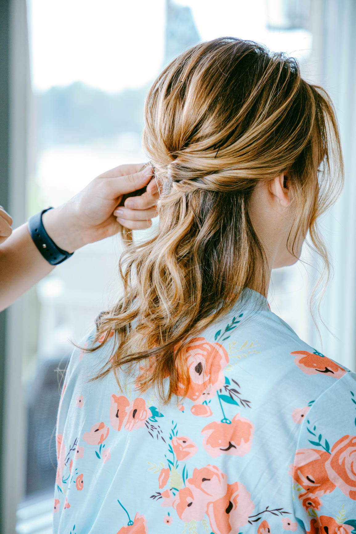 bride wearing a robe getting hair done for an elopement in Mooresville, NC | nhieutang.com