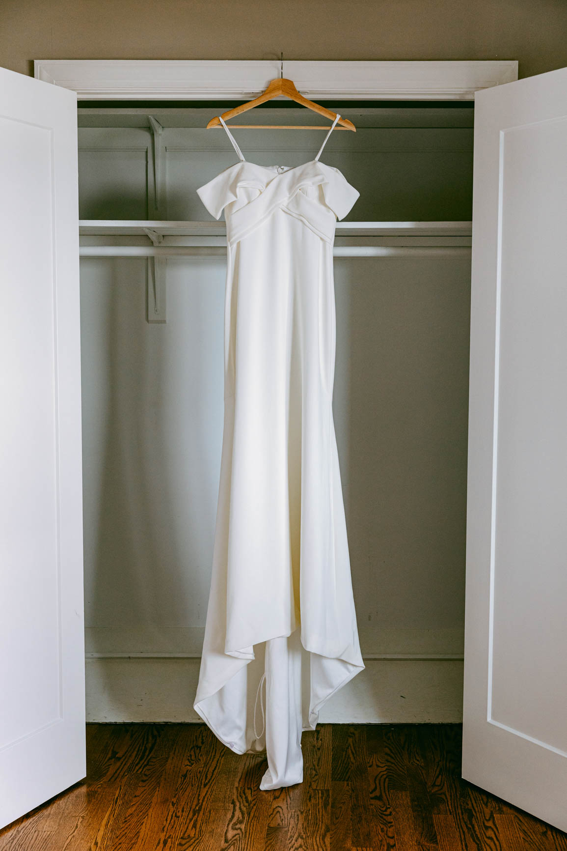 wedding dress hanging in lake house for elopement shot by Nhieu Tang Photography | nhieutang.com