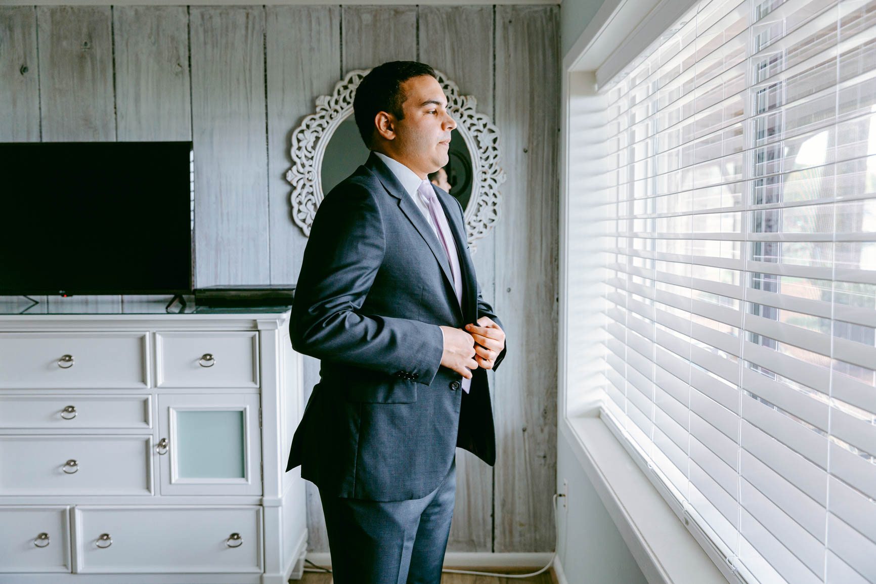 groom button up suit at a lake house elopement shot by Nhieu Tang Photography | nhieutang.com