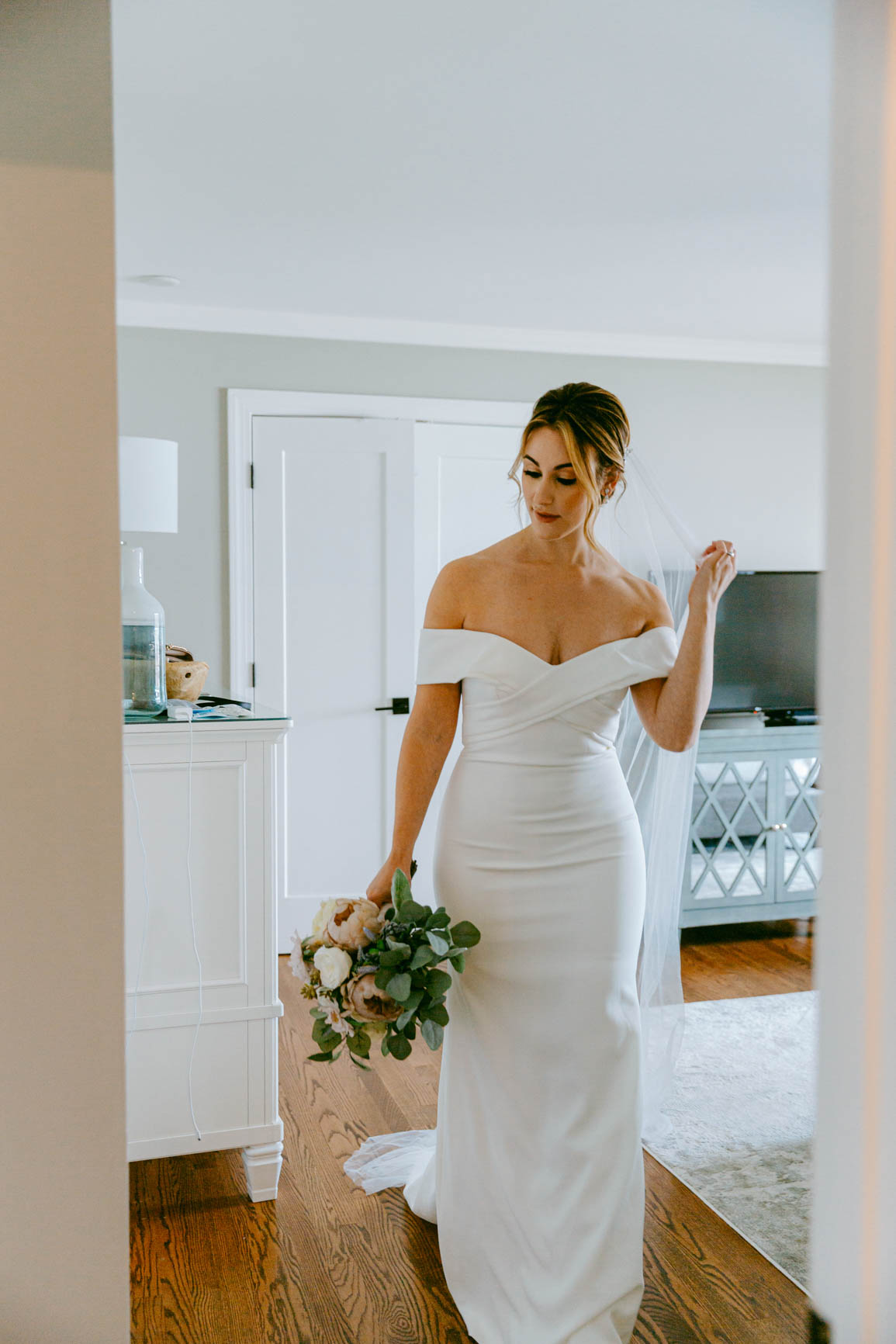 bride heading for a first look in Mooresville, NC lake house shot by Nhieu Tang Photography | nhieutang.com