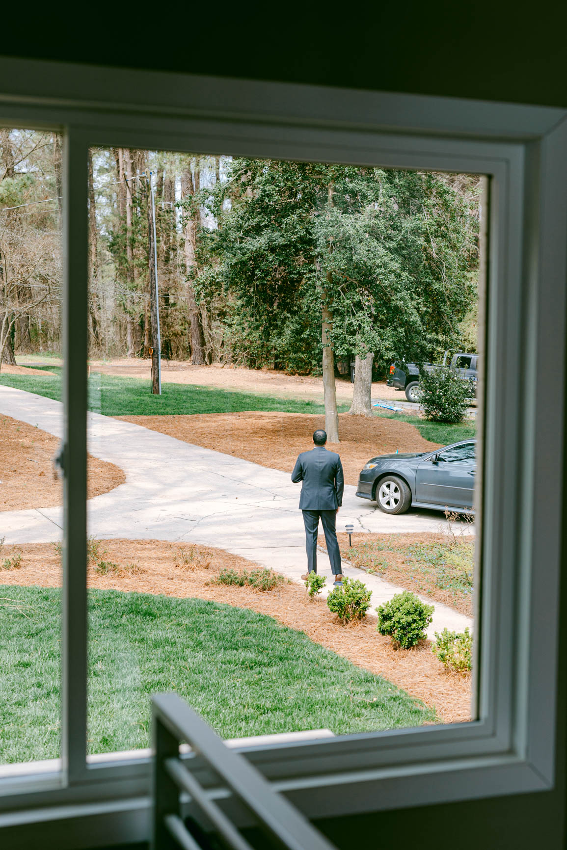 groom waiting outside for a firs look in Mooresville, NC