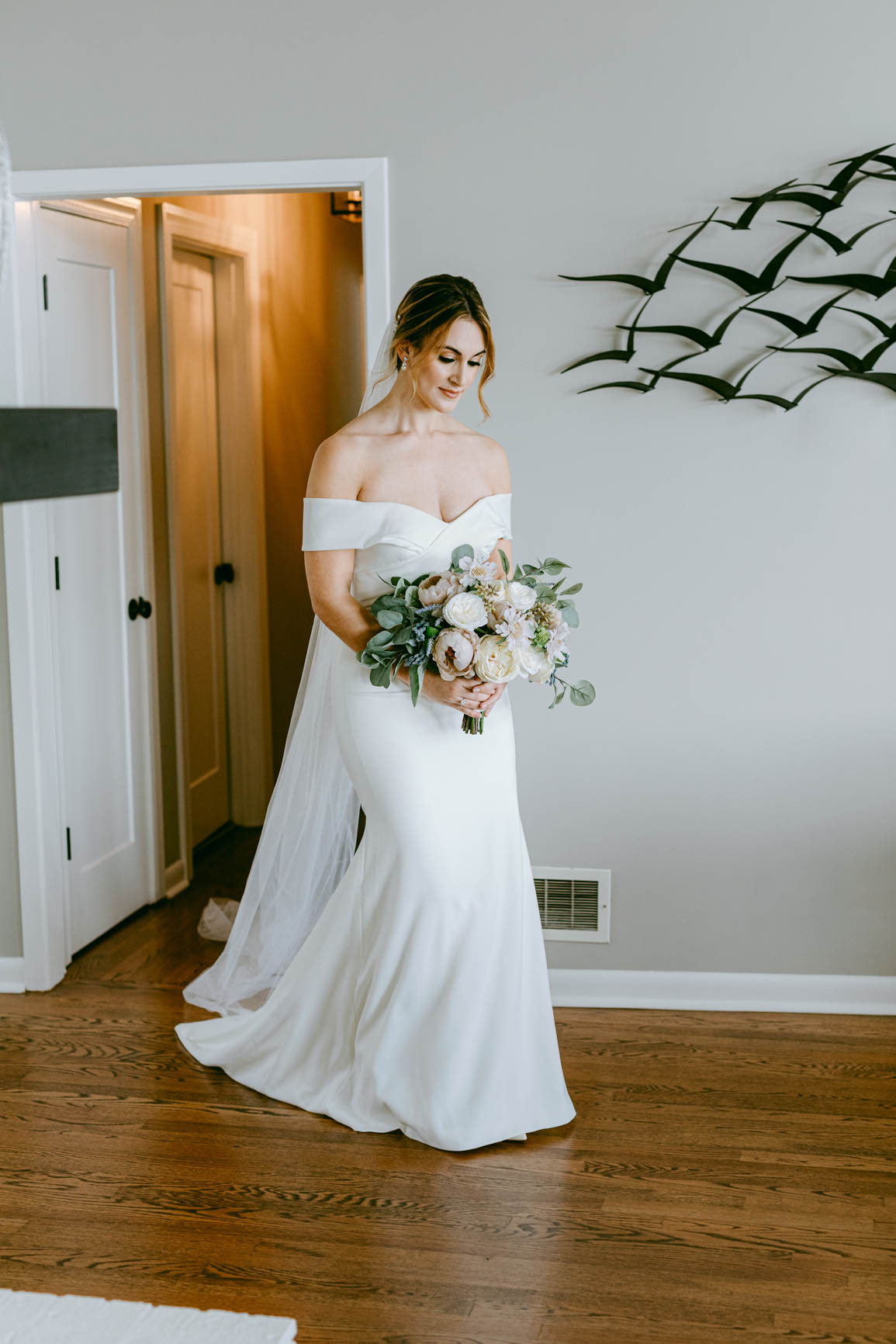 bride getting ready for a first look in Mooresville, NC lake house shot by Nhieu Tang Photography | nhieutang.com