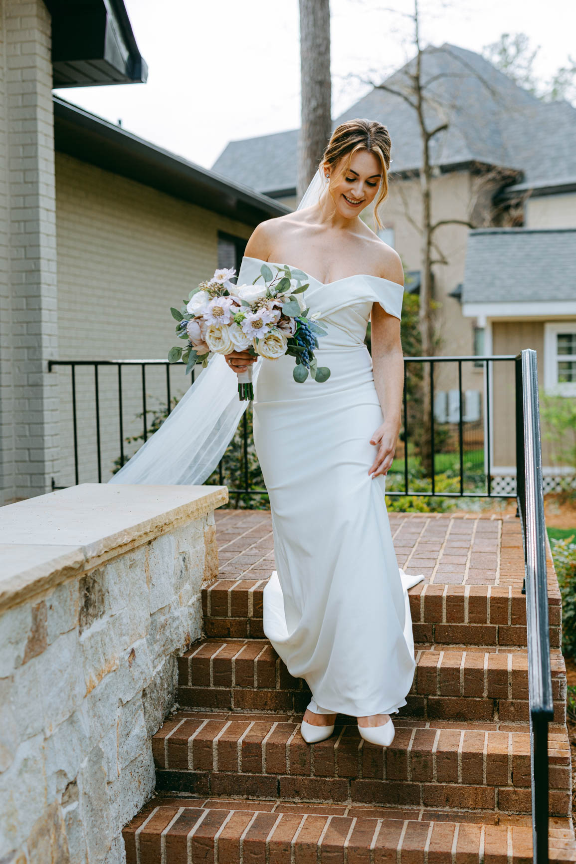 bride walking to groom for a first look in Mooresville, NC lake house shot by Nhieu Tang Photography | nhieutang.com