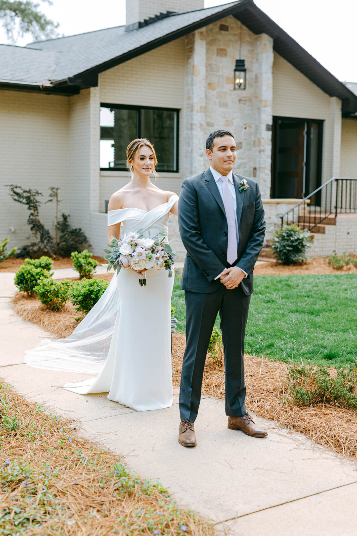 couple's first look at a lake house elopement in Mooresville, NC