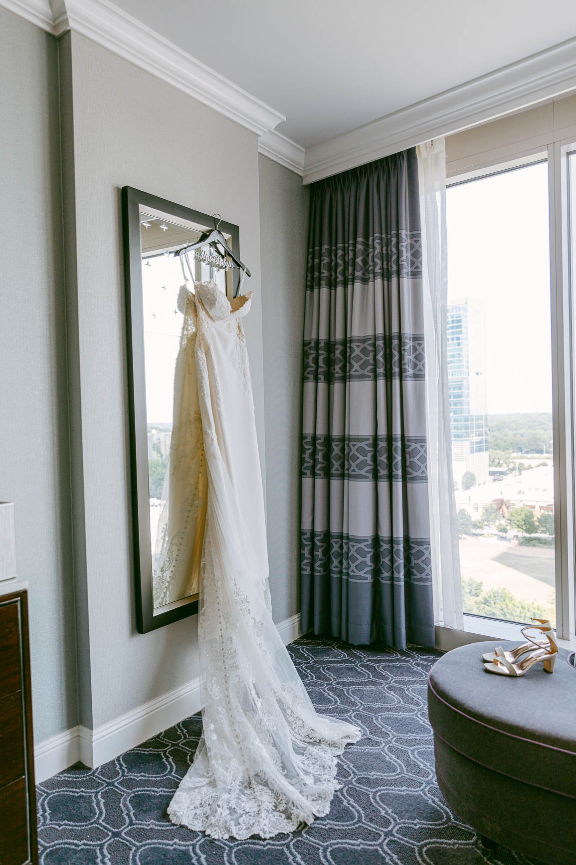 bride getting ready in uptown Charlotte at the Kimpton Tryon park hotel shot by Nhieu Tang Photography | nhieutang.com