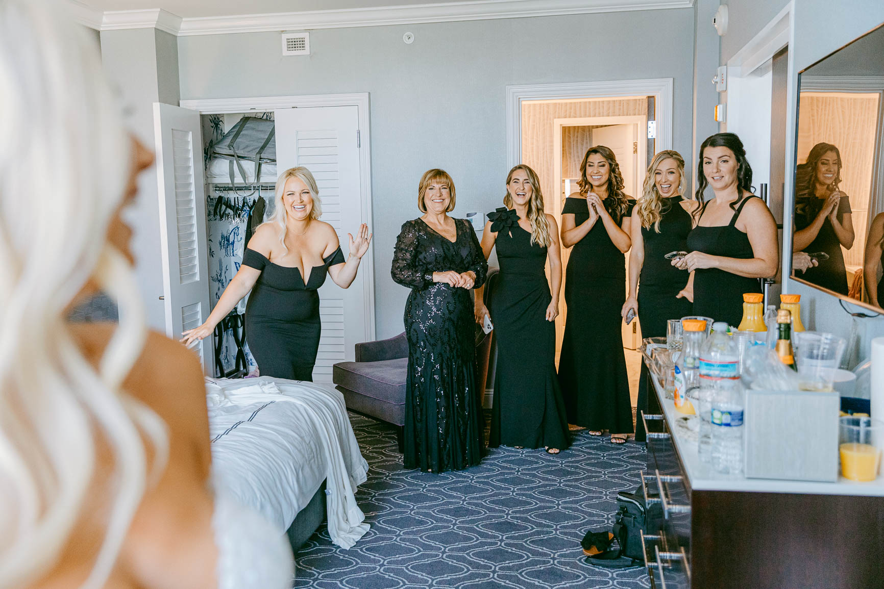 Bride first look with bridesmaid at the Kimpton Tryon park hotel by Nhieu Tang Photography | nhieutang.com