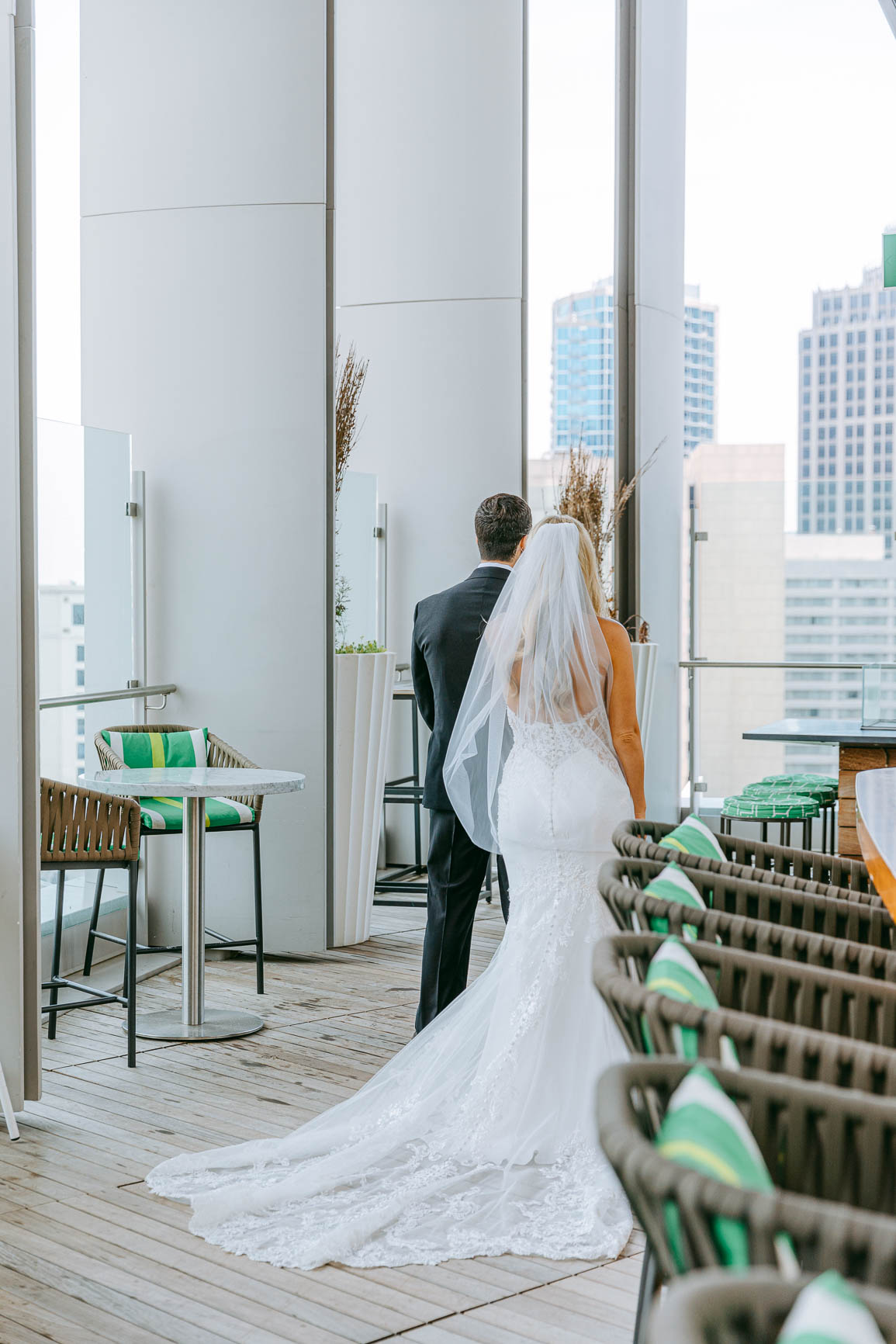 Bride and groom first look at merchant & trade rooftop in Charlotte nc shot by Nhieu Tang Photography | nhieutang.com