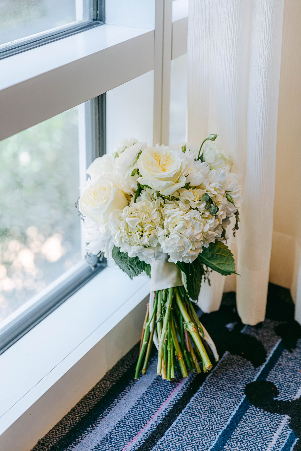 bride bouquet shot inside Kimpton Tryon park hotel  in uptown Charlotte nc by Nhieu Tang Photography | nhieutang.com