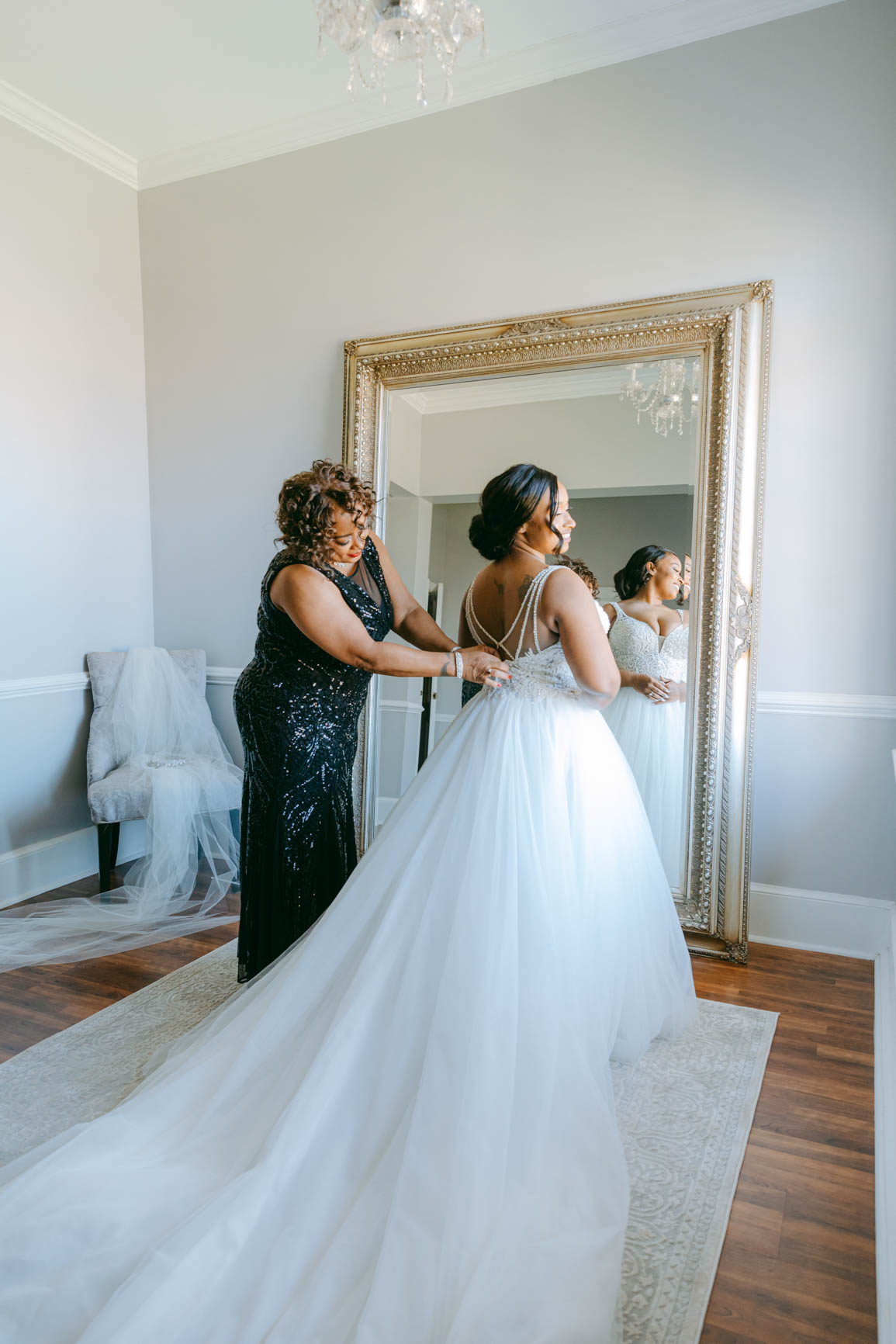 bride mother helping with dress at Separk Mansion in Gastonia NC shot by Nhieu Tang Photography | nhieutang.com