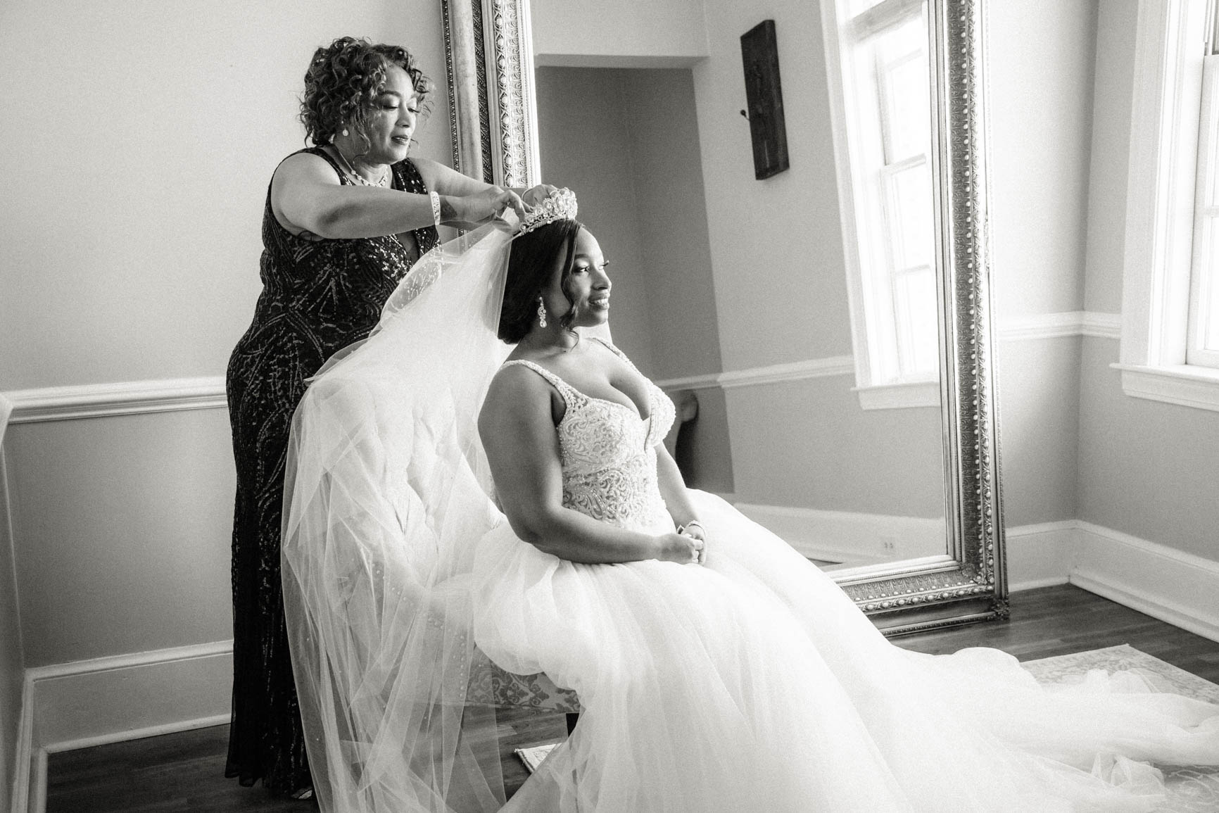 bride's mom fixing bride's veil at Separk Mansion in Gastonia NC shot by Nhieu Tang Photography | nhieutang.com