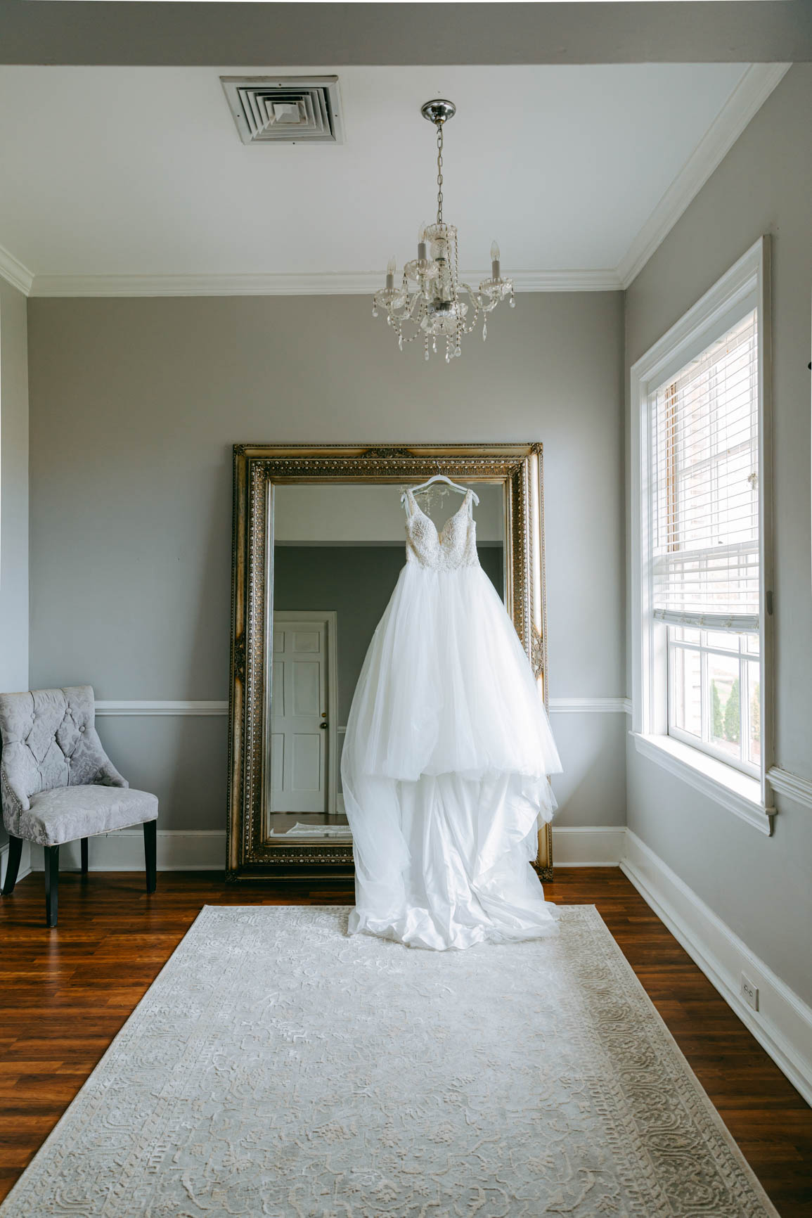 Wedding dress by the mirror at Separk Mansion in Gastonia NC