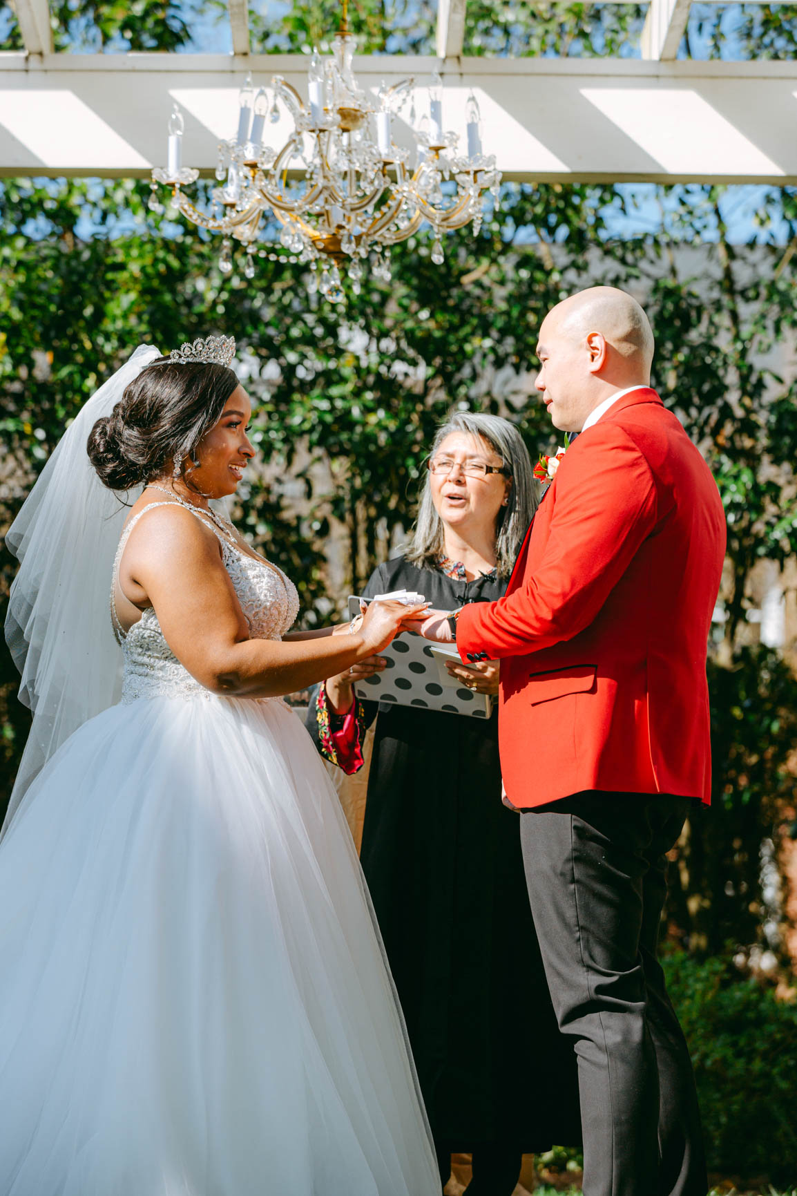 bride and groom exchanging ring at Separk Mansion in Gastonia NC shot by Nhieu Tang Photography | nhieutang.com