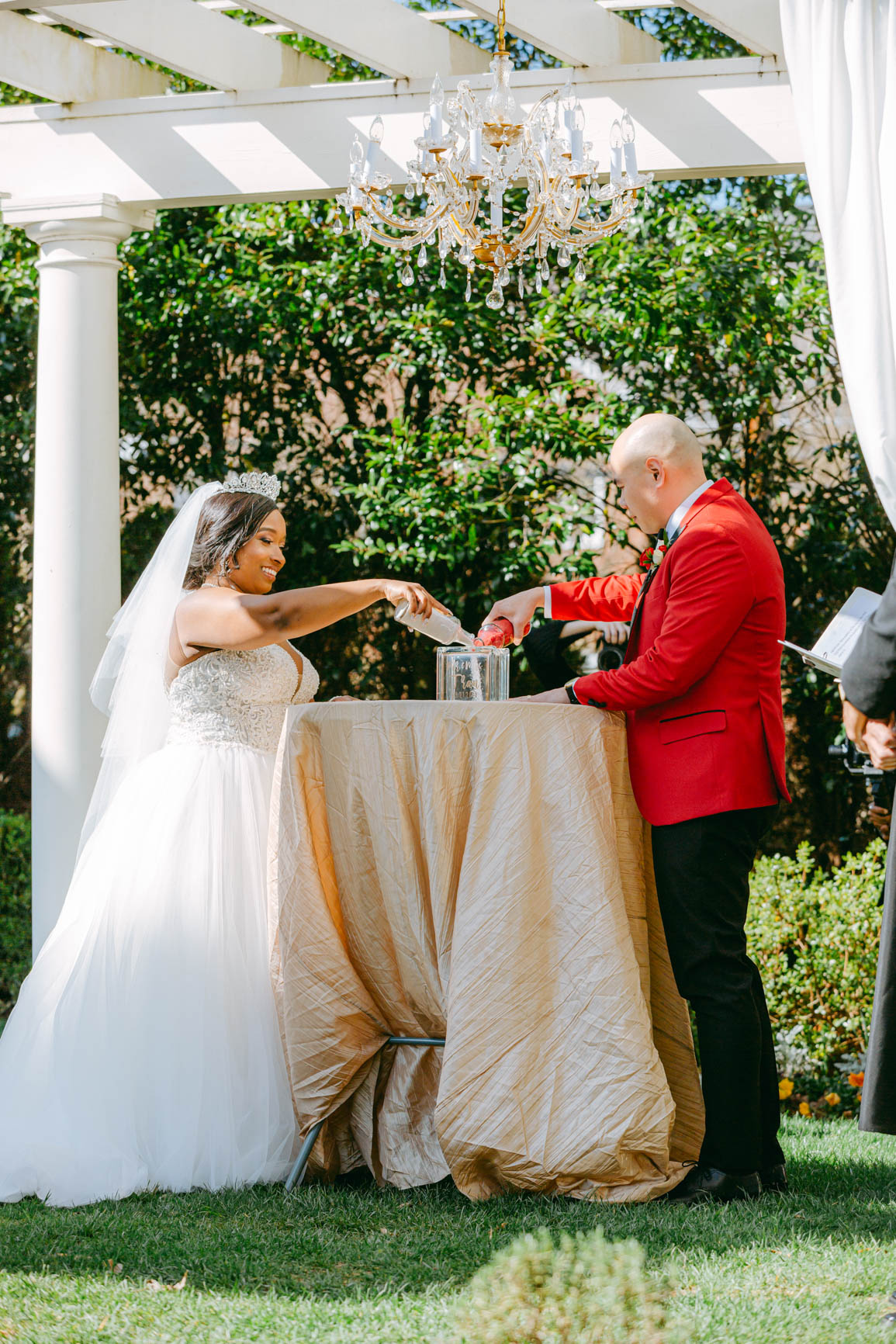 bride and groom pouring unity sand ceremony at Separk Mansion in Gastonia NC shot by Nhieu Tang Photography | nhieutang.com