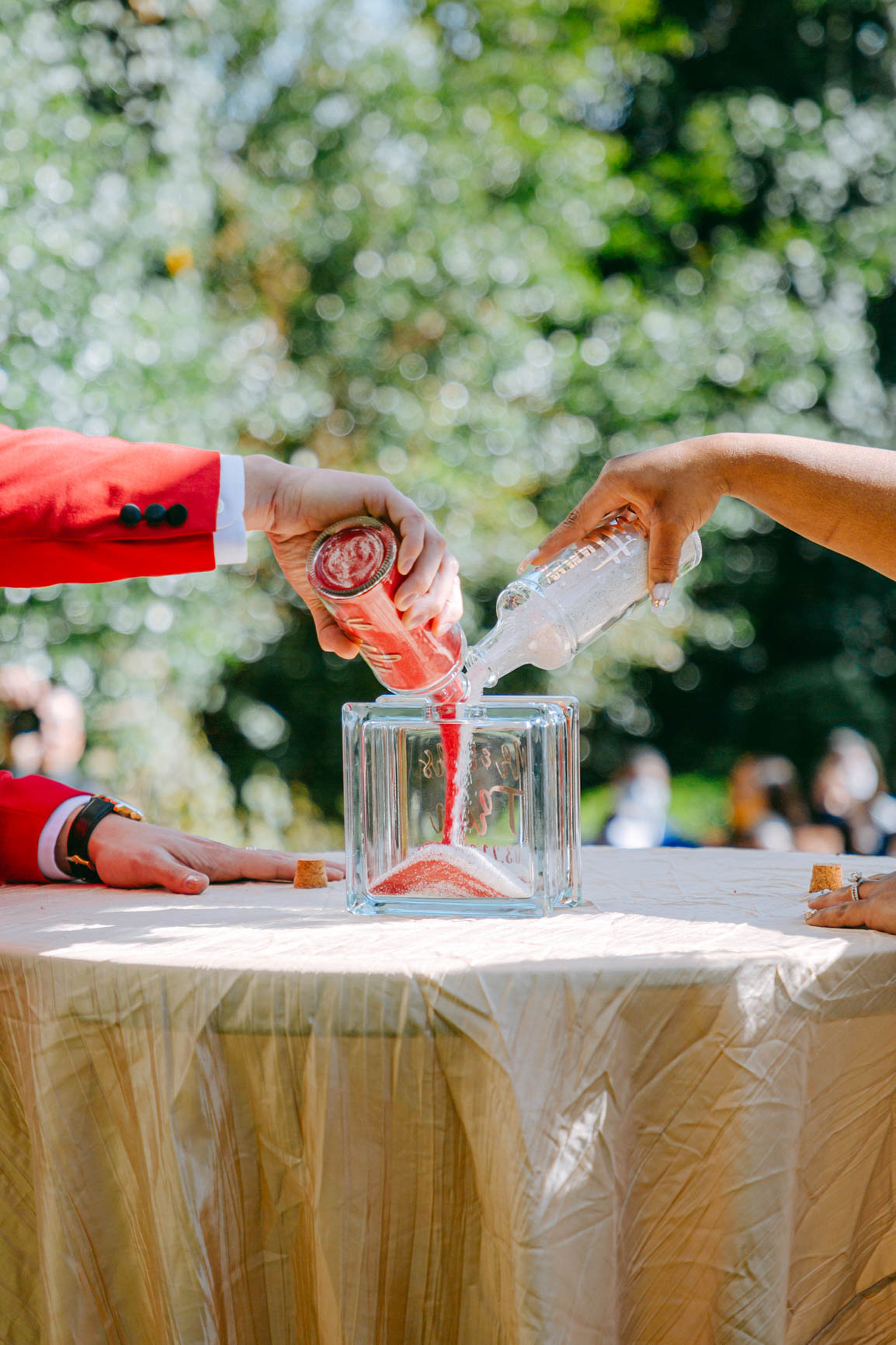 bride and groom pouring unity sand ceremony at Separk Mansion in Gastonia NC shot by Nhieu Tang Photography | nhieutang.com