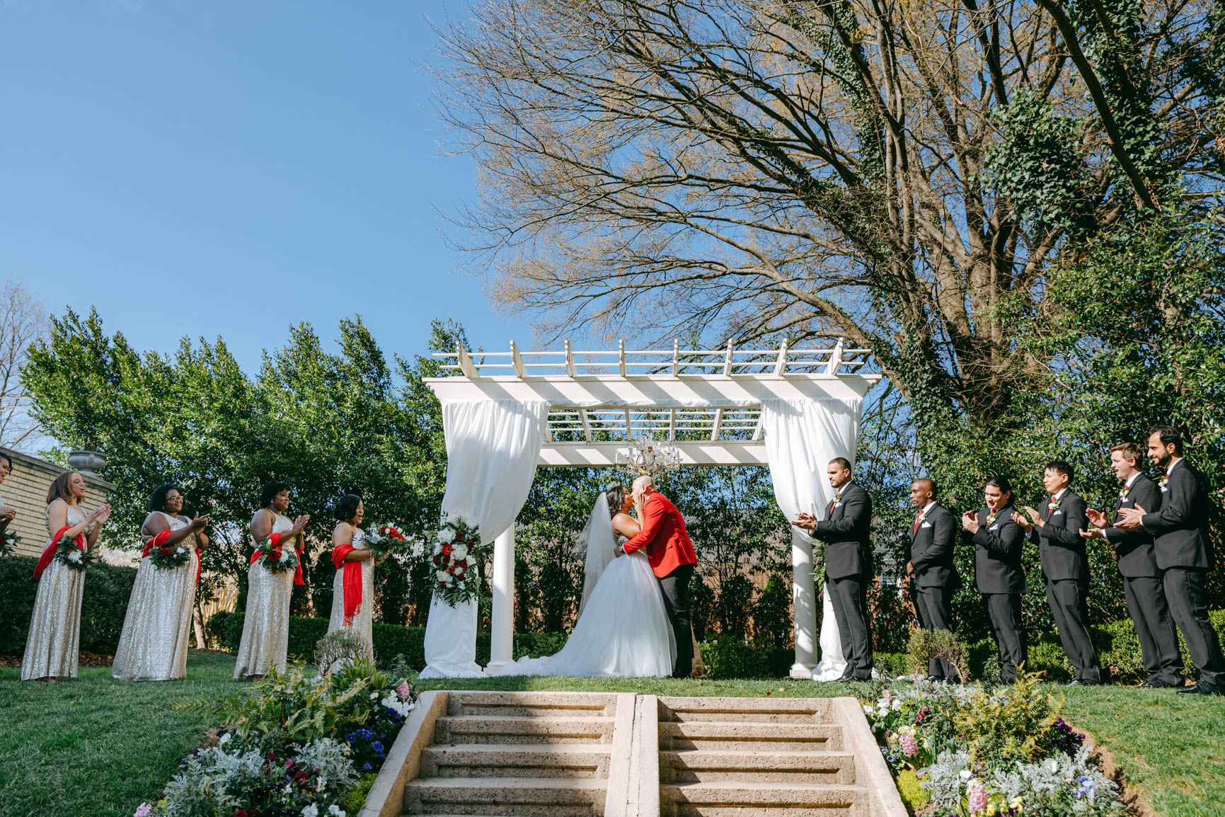 Bride and groom first kiss at Separk Mansion in Gastonia NC shot by Nhieu Tang Photography | nhieutang.com